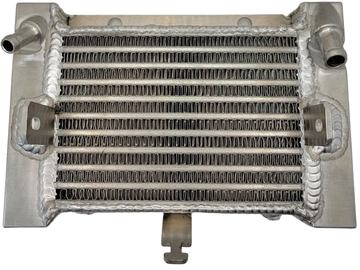 A radiator with many pipes and wires on it