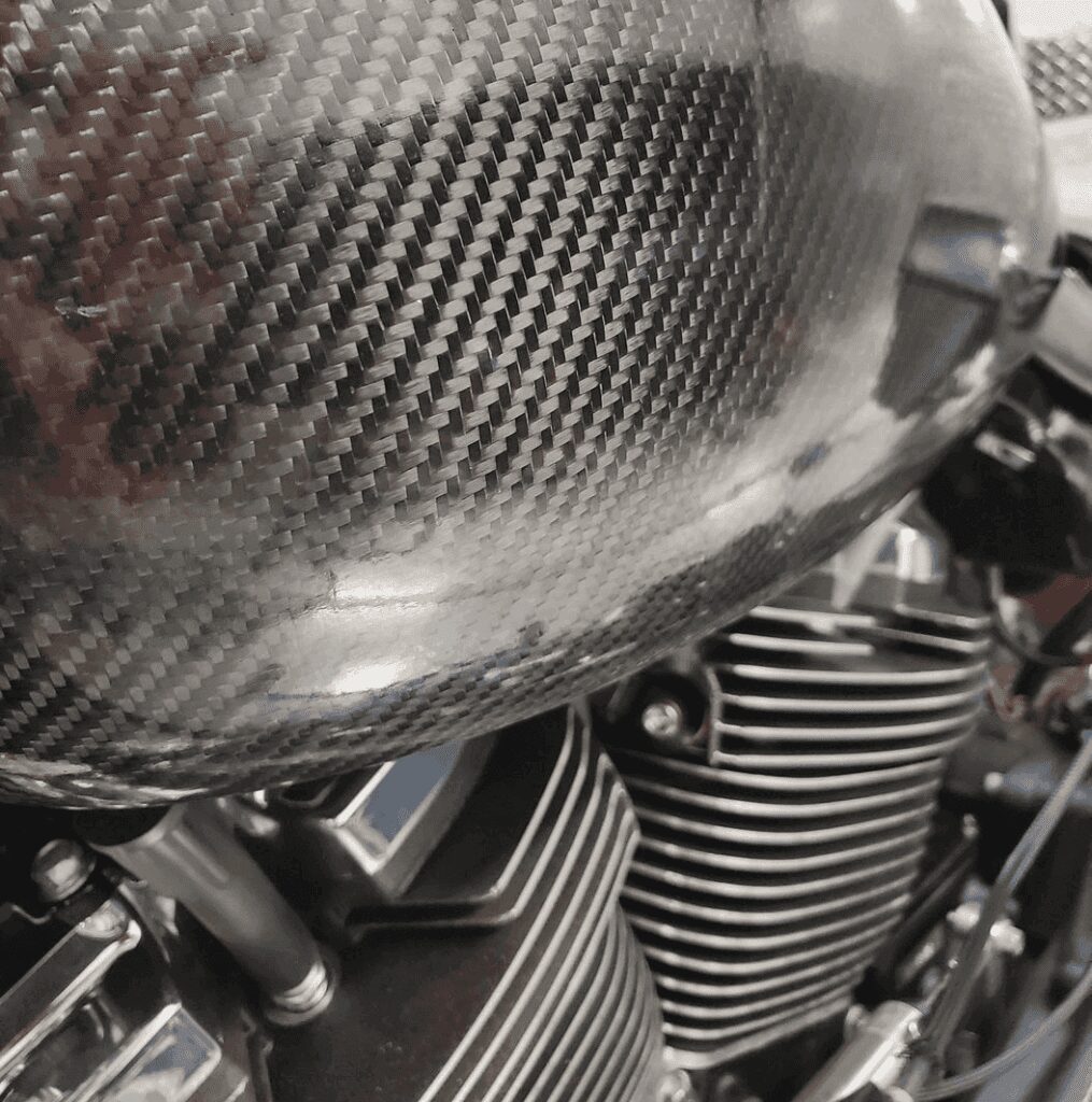 A close up of the engine cover on a motorcycle.