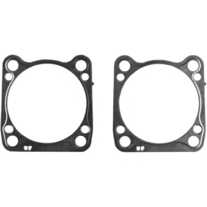 A pair of gaskets for the head gasket on a motorcycle.