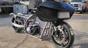 A motorcycle with a black cover on it