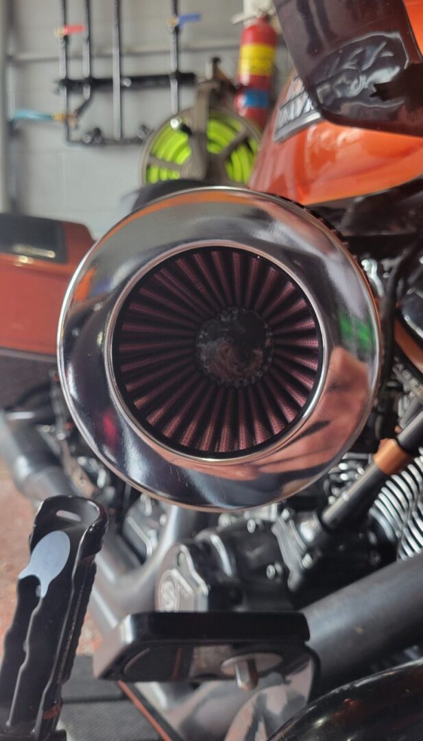 Motorcycle air filter with chrome cover.